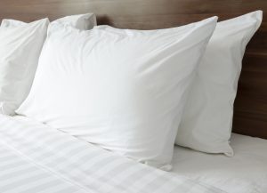 White,Pillows,On,A,Bed,Comfortable,Soft,Pillows,On,The